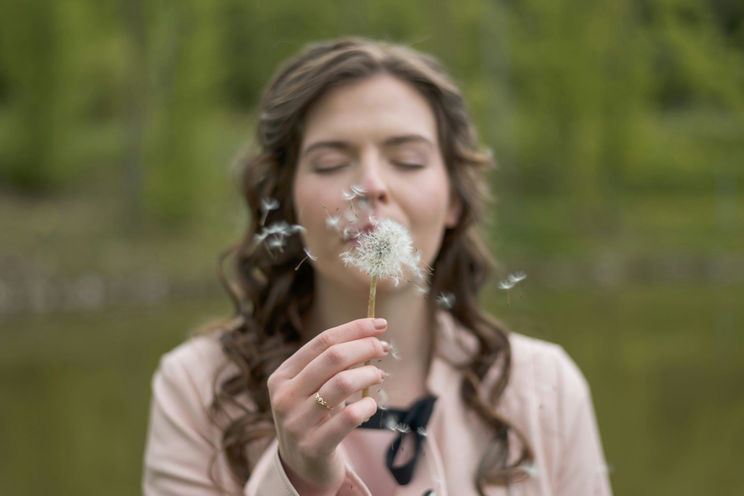 Woman applying organic cream while smiling