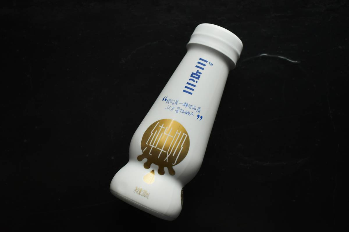 Assorted bottles of organic moisturizer on wooden table