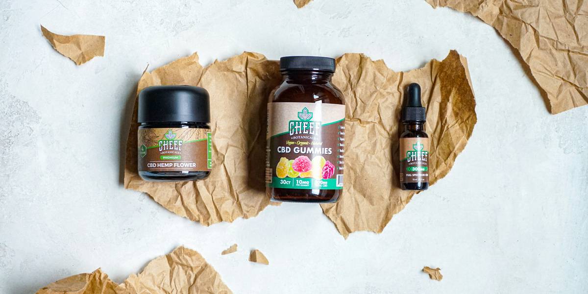 Close-up of someone comparing two jars of skincare products.