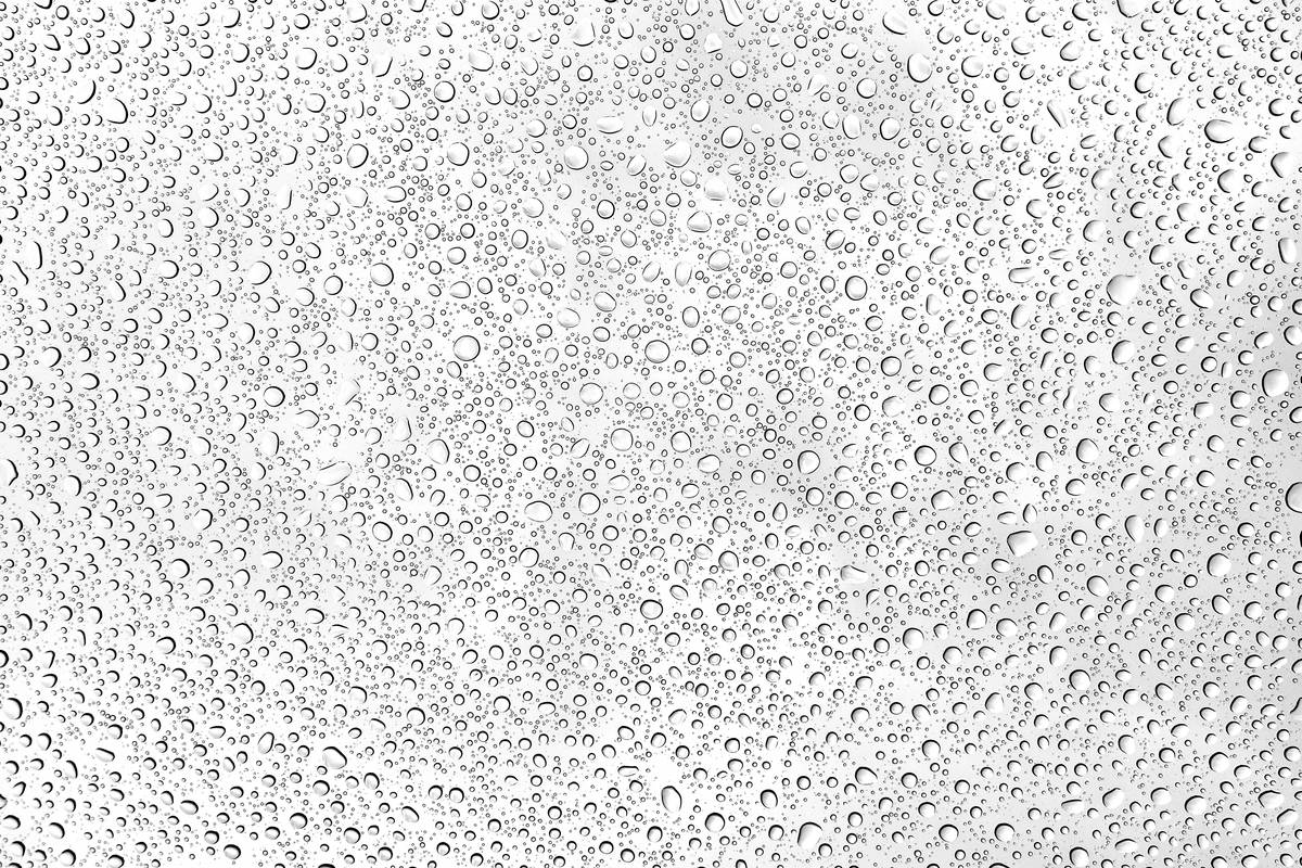 Woman performing a patch test on her wrist before applying a cream