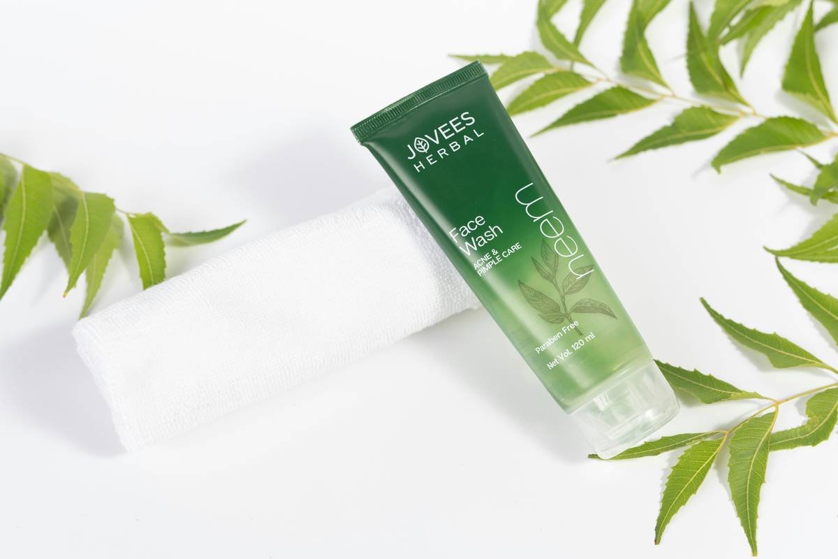 Before and after photos of John Smith's skin, showing reduced redness and improved overall appearance.