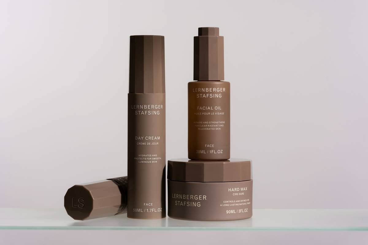 A collection of skincare essentials, including day cream, facial oil, and hard wax, designed for hydration, radiance, and long-lasting styling.