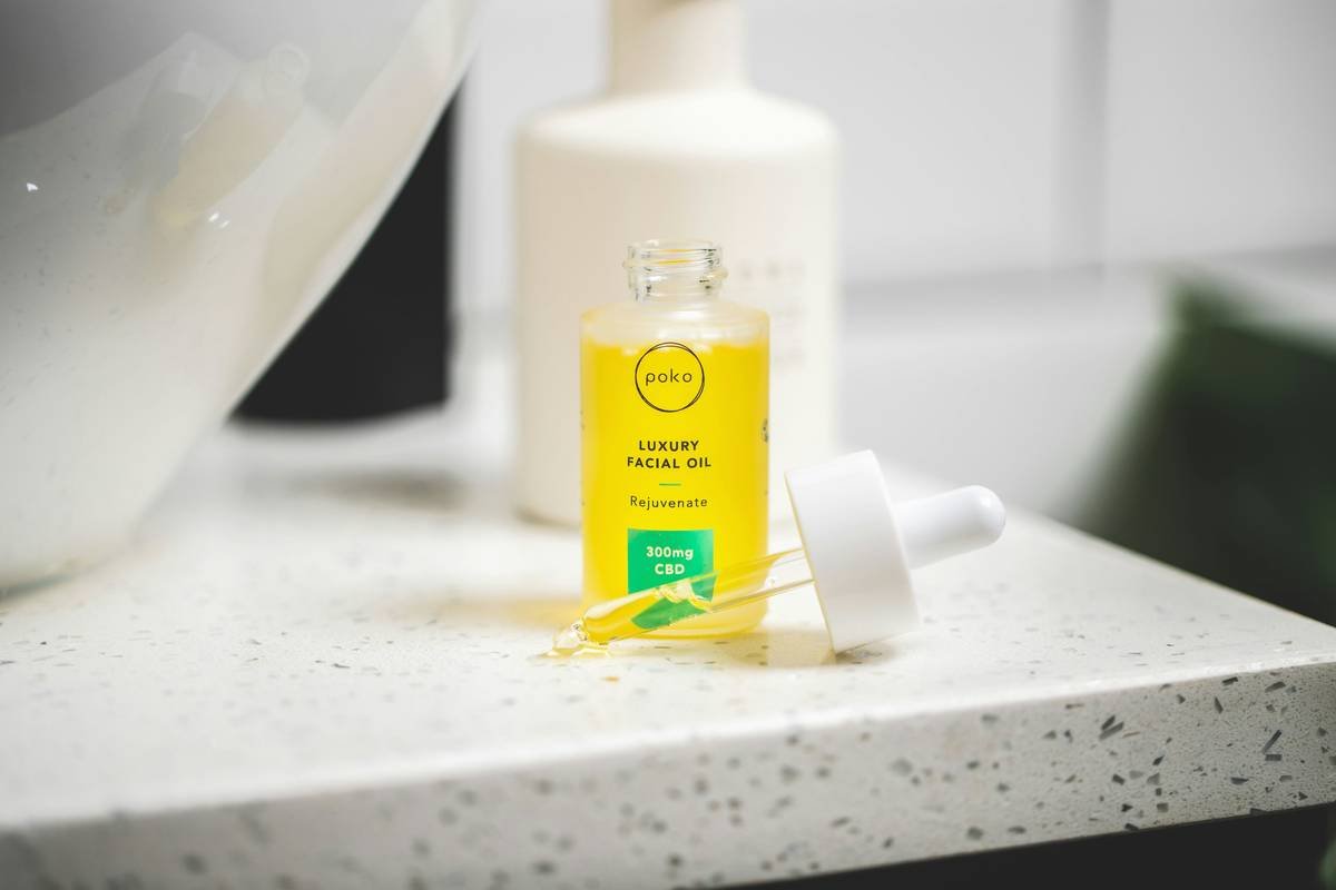 Luxury skin care facial oil at sink